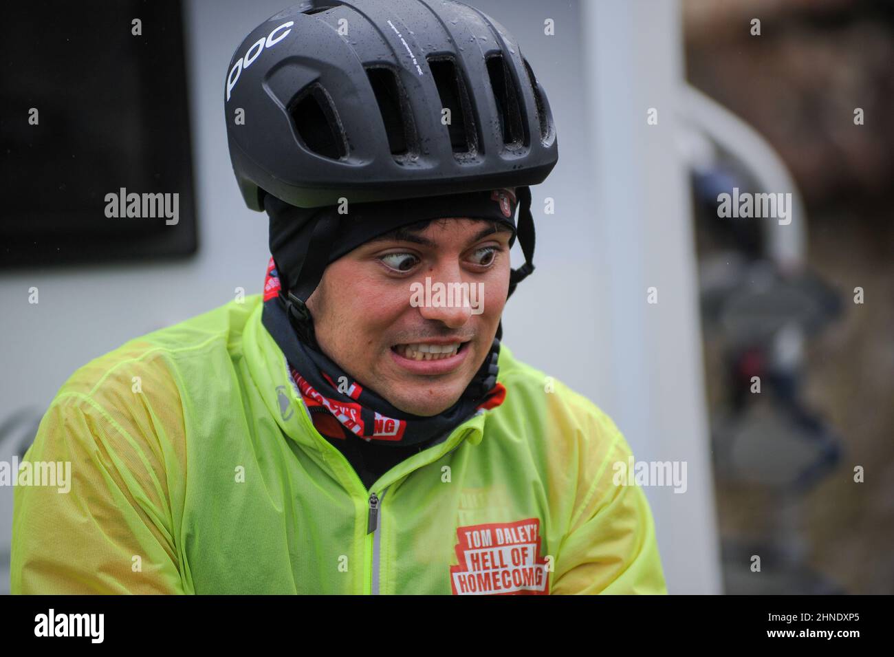 Winterbourne Abbas, Dorset, UK. 16th February 2022. Olympic gold medalists Tom Daley stops for lunch after 7 hours of riding on day 3 of his Comic Relief Hell of a Homecoming Challenge from the Queen Elizabeth Olympic Park in London to his hometown of Plymouth in Devon. On this leg he is cycling 130 miles from Southampton to Bovey Castle on Dartmoor in Devon. Credit: David Partridge / Alamy Live News Stock Photo