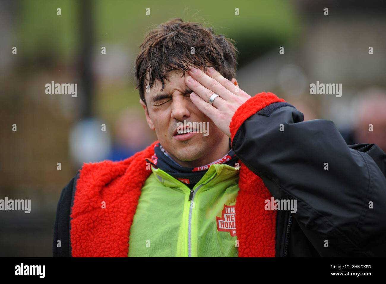 Winterbourne Abbas, Dorset, UK. 16th February 2022. Olympic gold medalists Tom  Daley feels the strain after 7 hours of riding on day 3 of his Comic Relief  Hell of a Homecoming Challenge