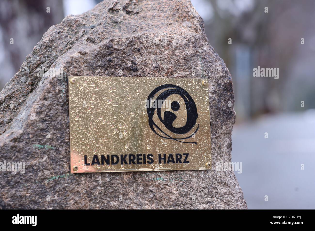 Schierke, Germany. 16th Feb, 2022. A plaque with the inscription Landkreis Harz is attached to a boundary stone on the Brocken road. The first foothills of Storm Ylenia reach the Harz Mountains. In the course of the night, the storm is expected to increase further and reach wind speeds of up to 180 kilometers per hour. Credit: Matthias Bein/dpa-Zentralbild/dpa/Alamy Live News Stock Photo