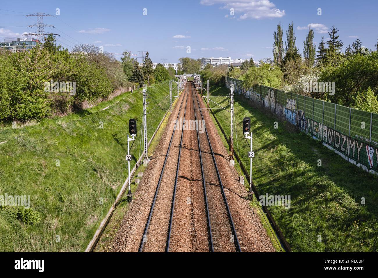 View on the railroad tracks on the edge of Wlochy and Ochota districts of Warsaw, capital of Poland Stock Photo