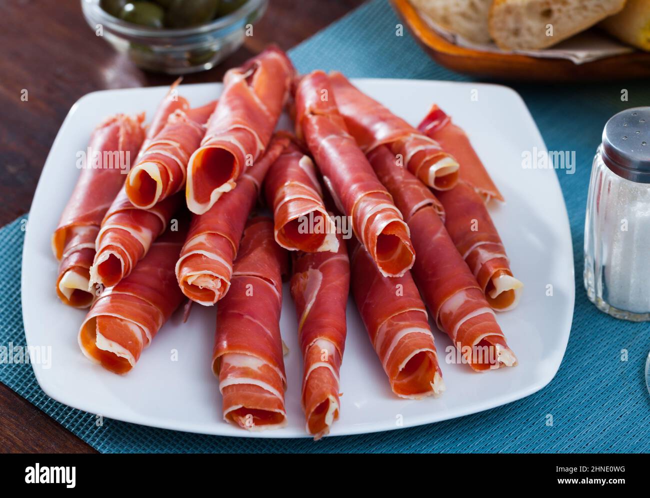Drycured ham slices on white platter Stock Photo Alamy