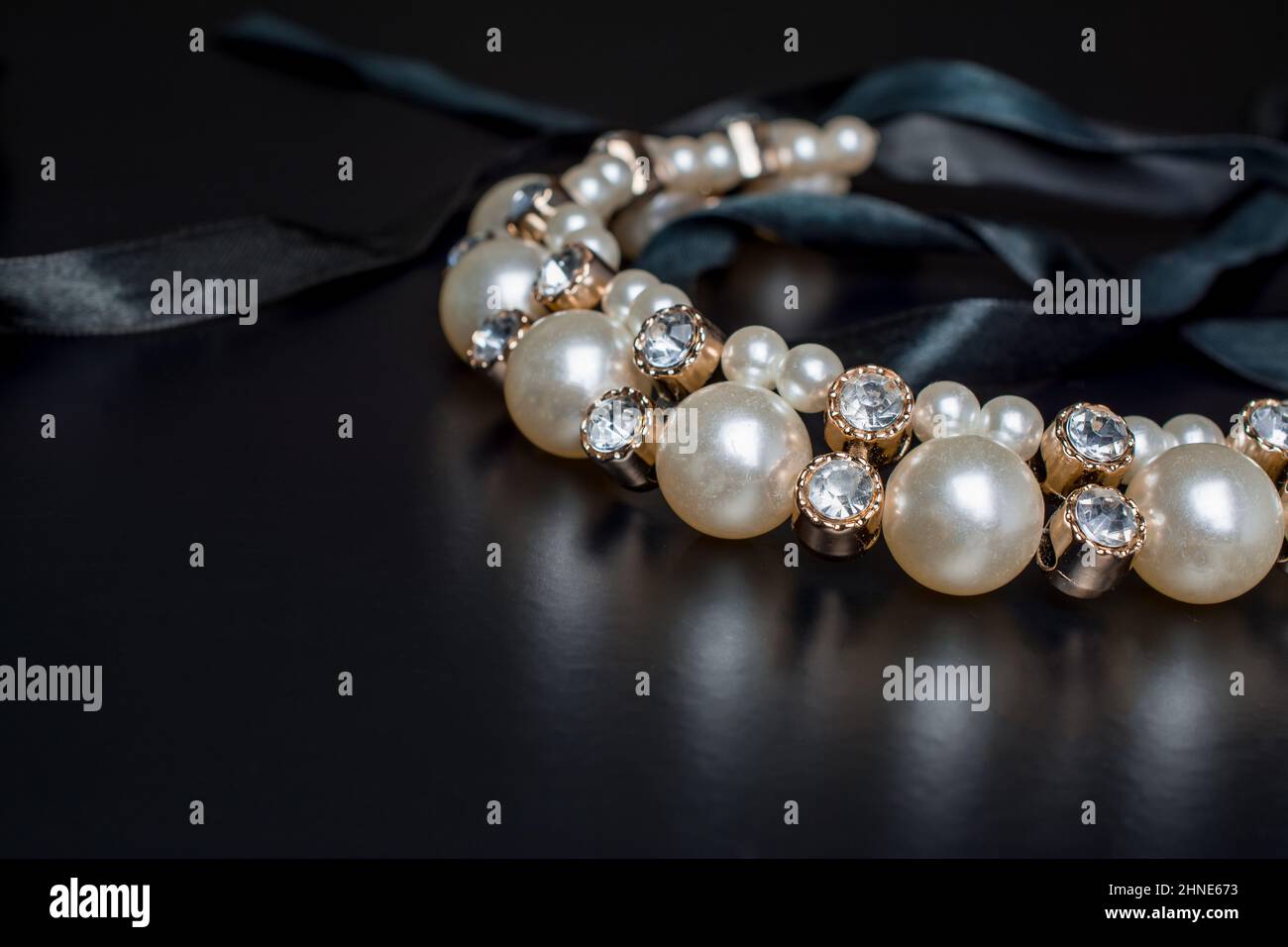 pile of gold on black background Stock Photo - Alamy
