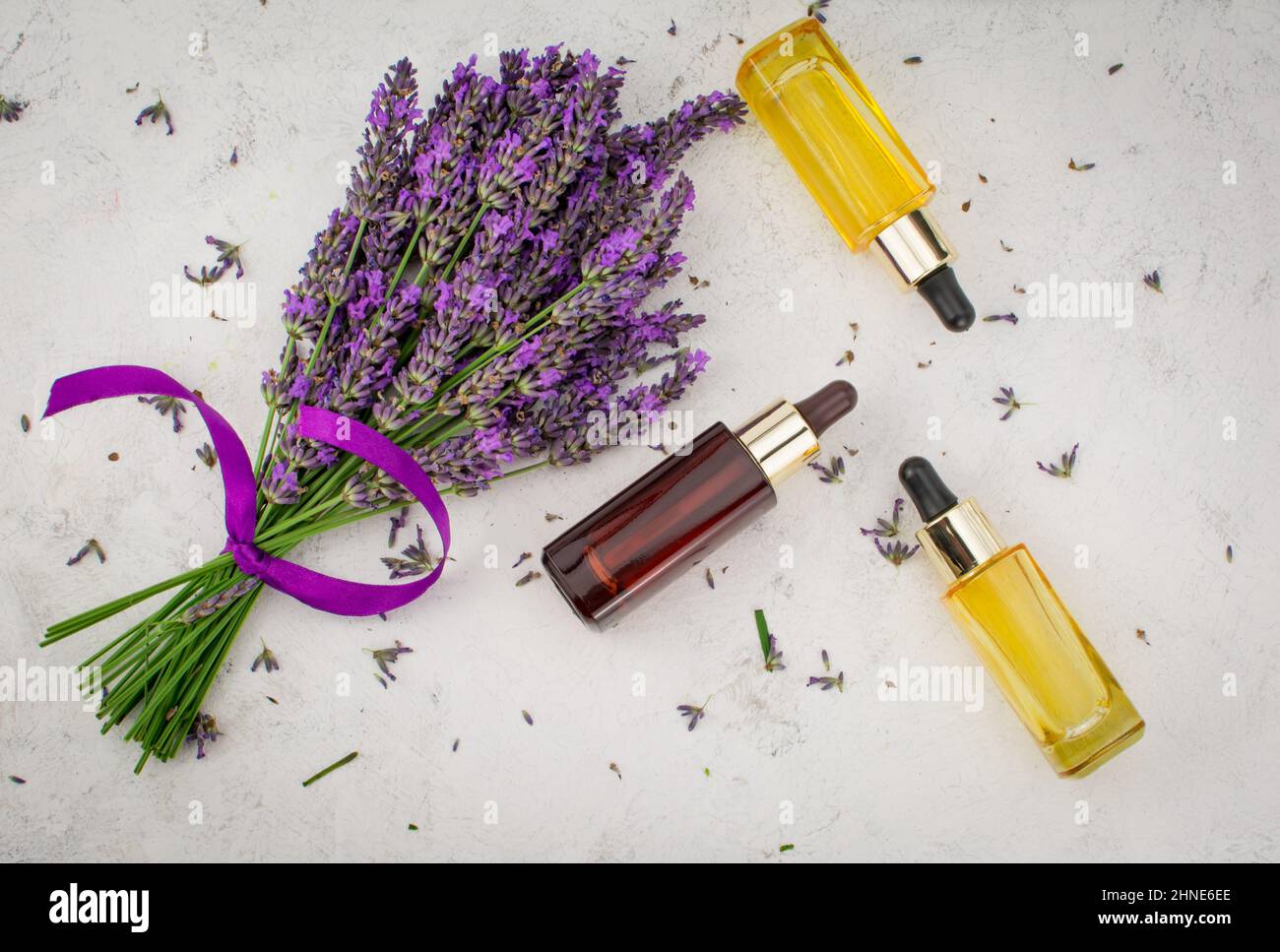 pink background with lavender flowers and oil bottle Stock Photo - Alamy