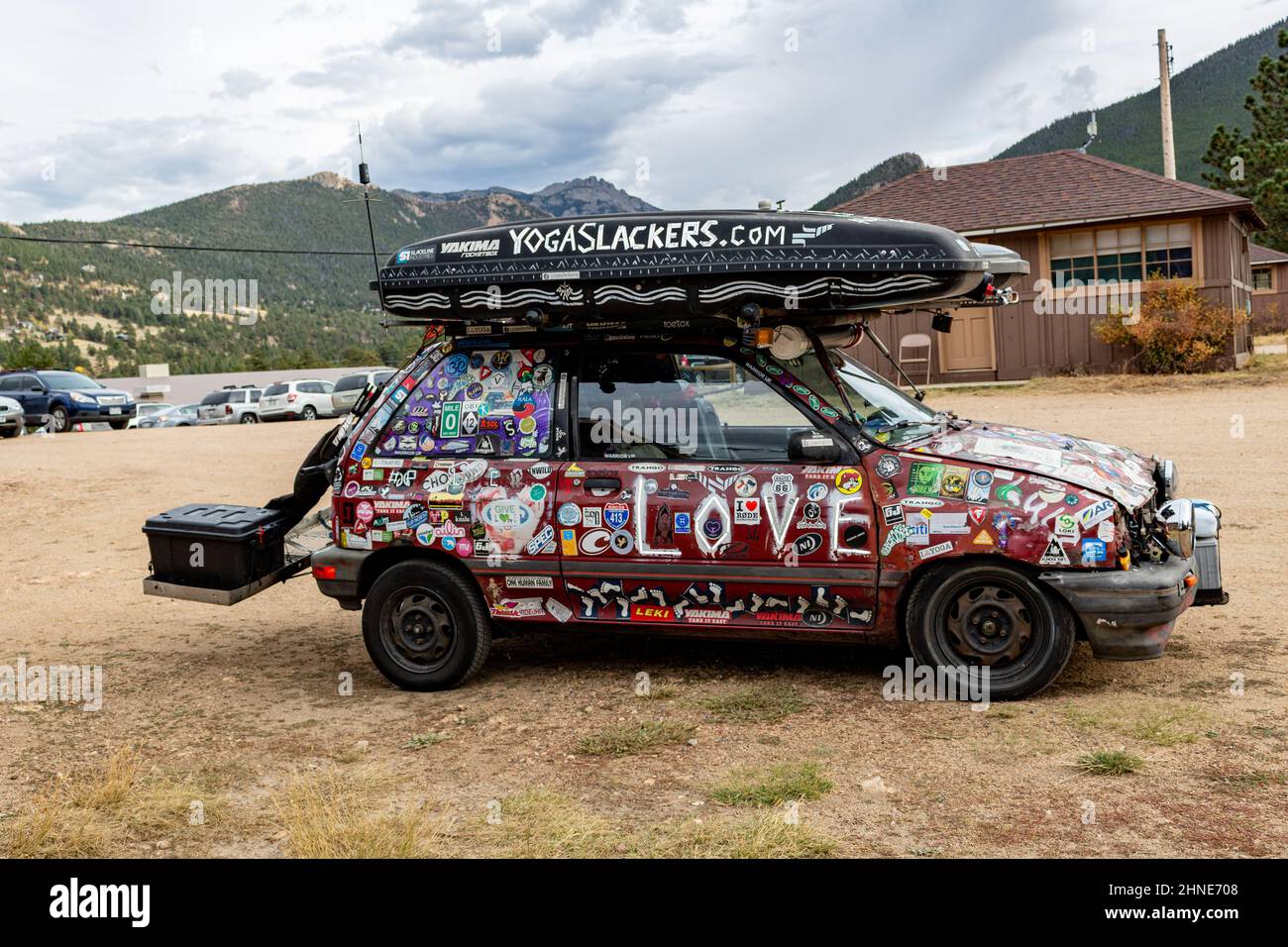 The Peace Love Car, a 1988 Ford Festiva covered with decals, transportation and home to two traveling yoga teachers. Stock Photo