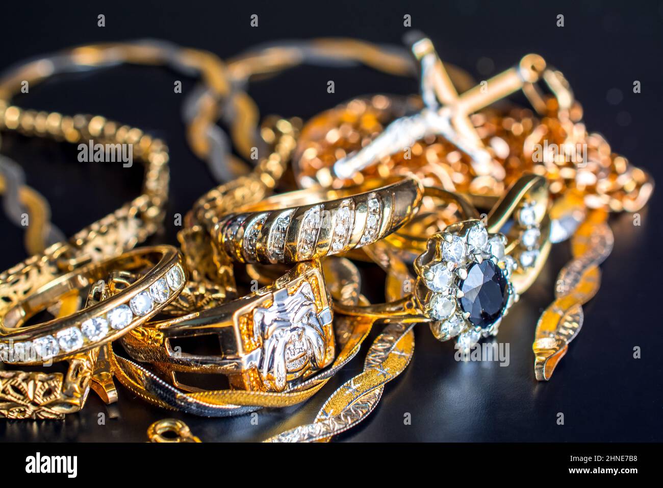 pile of gold on black background Stock Photo - Alamy