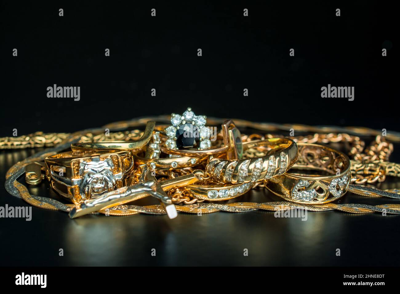 pile of gold on black background Stock Photo - Alamy
