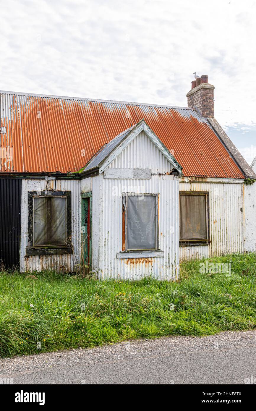 A derelict property made of corrugated iron at Southend on the Kintyre Peninsula, Argyll & Bute, Scotland UK Stock Photo