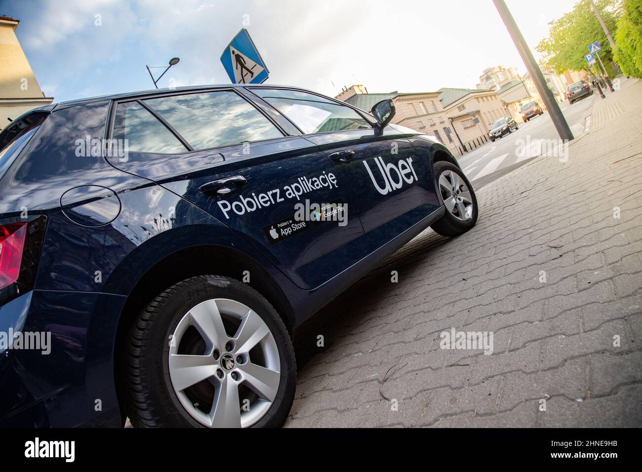 Uber car (Skoda) with inscription on the street before sunset Stock Photo