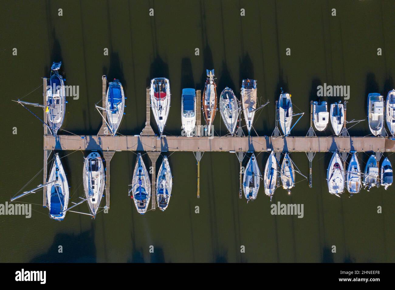 Aerial view over berthing jetty with sailing boats at marina in harbour of the city Stralsund along the Strelasund, Mecklenburg-Vorpommern, Germany Stock Photo
