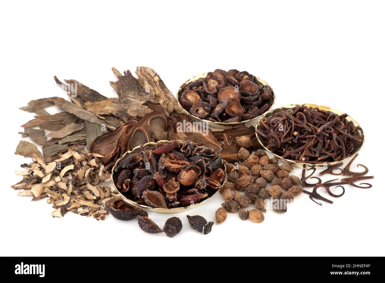 Chinese herbal medicine with herbs and spice used in ancient and traditional healing remedies. Natural plant medicine. On white background. Stock Photo