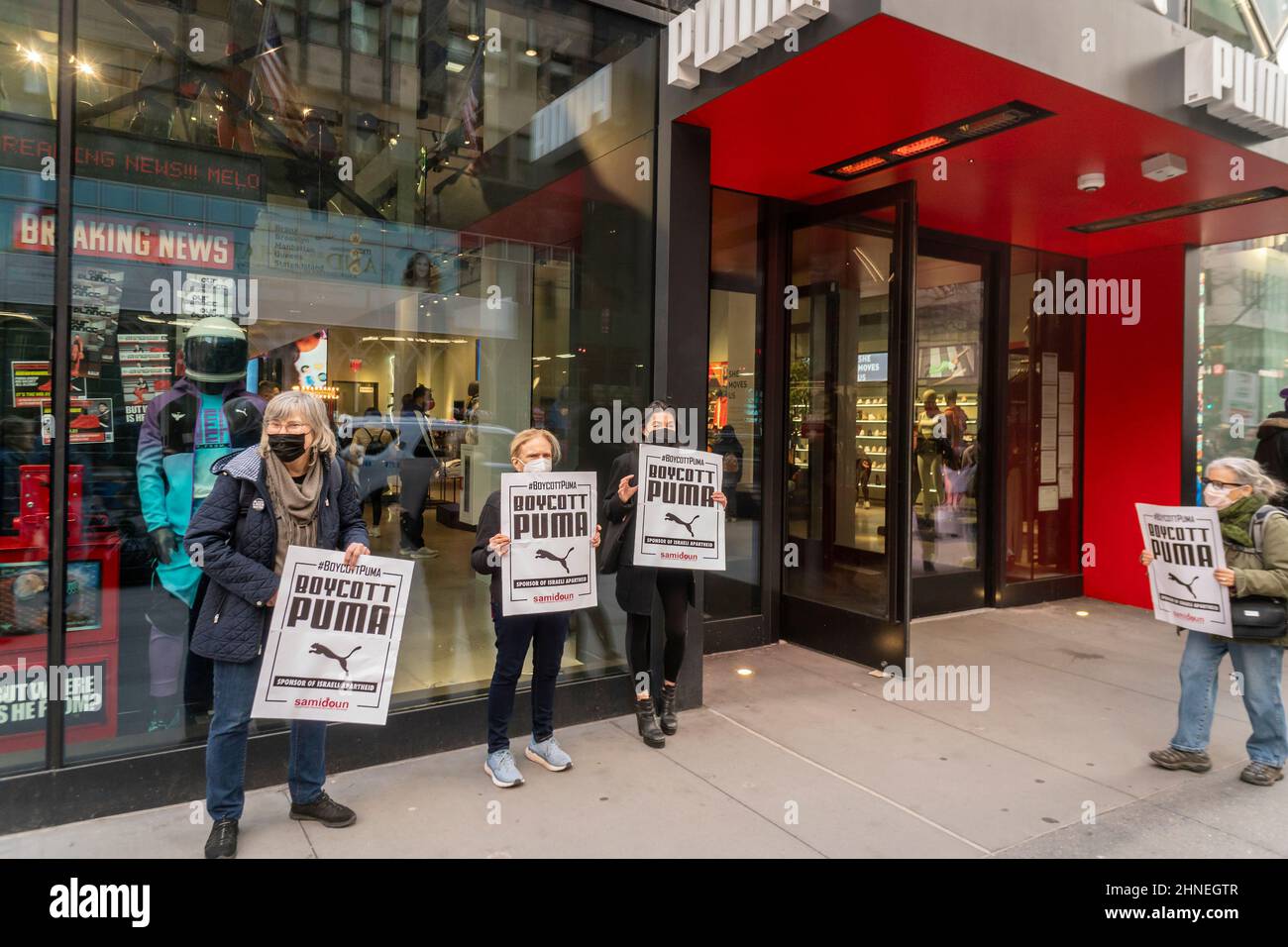 Members and supporters of Samidoun, the Palestinian Prisoner Solidarity Network, protest in front of the Puma store on Fifth Avenue in New York on Saturday, February 12, 2022. The activists are a calling for a boycott of the German athletic wear company objecting to their sponsorship of the Israeli Soccer Association.  (© Richard B. Levine) Stock Photo