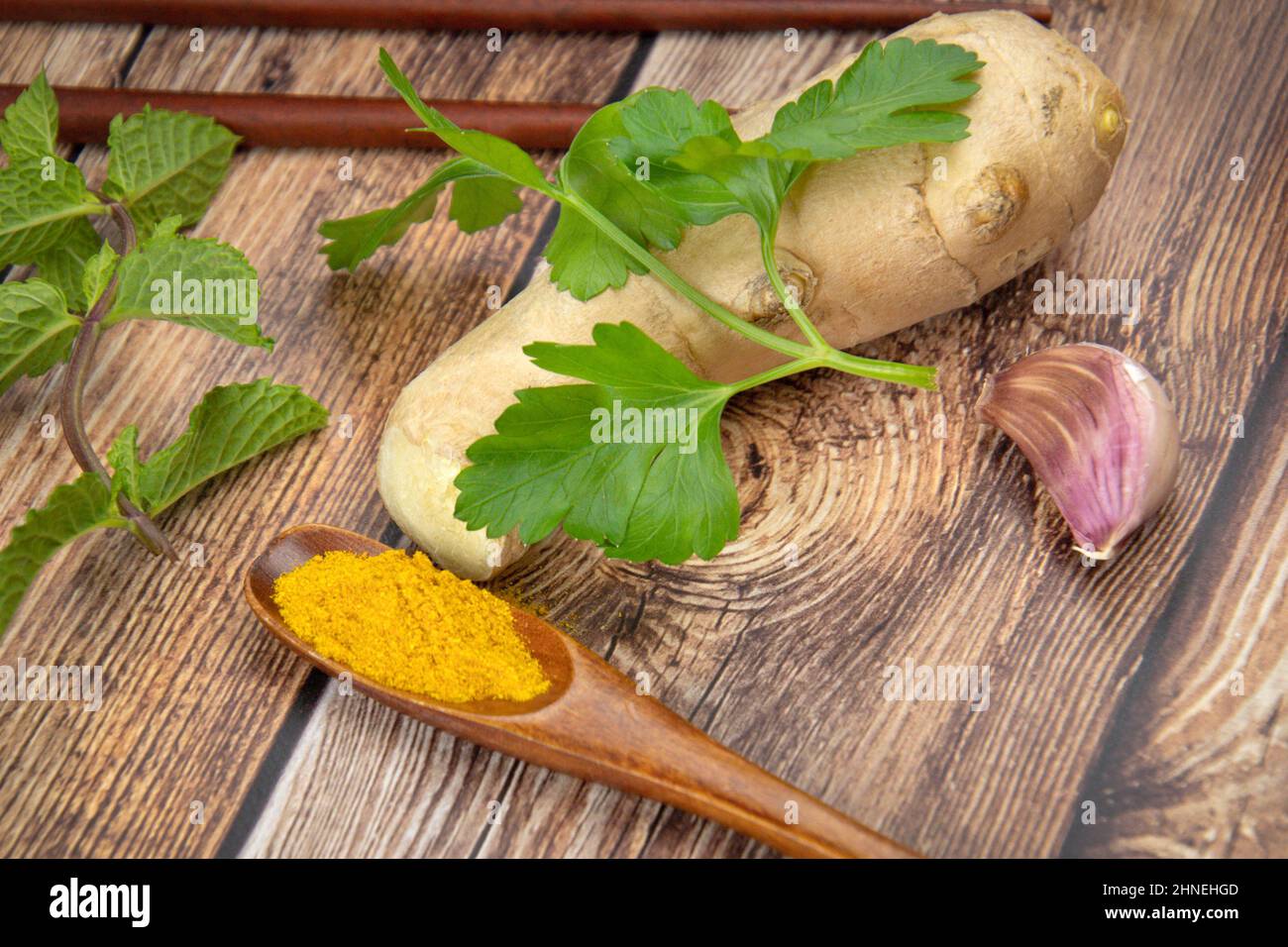 fresh ground ginger on a wooden background Stock Photo