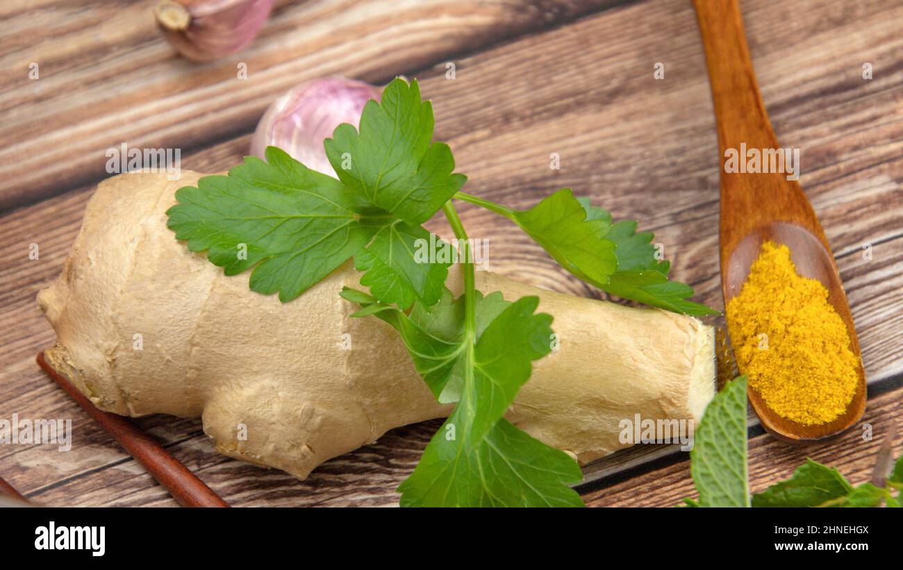 fresh ground ginger on a wooden background Stock Photo