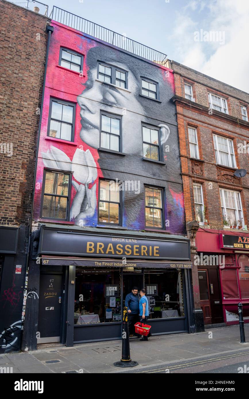 Graffiti art in Brick Lane, iconic London street, home to Bangladesh community known for its curry restaurants, now a trendy hipster area, Tower Hamle Stock Photo