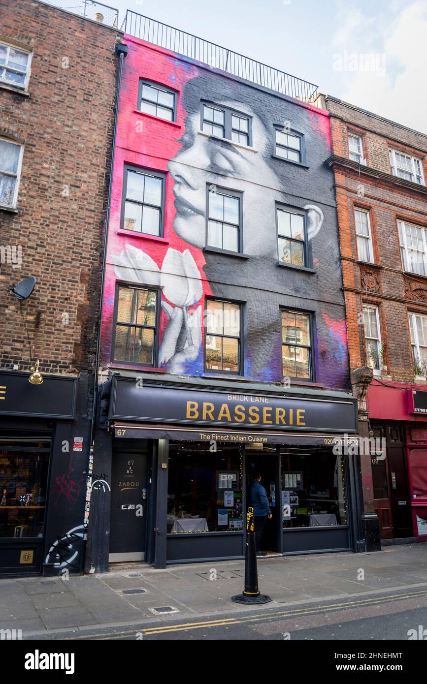 Graffiti art in Brick Lane, iconic London street, home to Bangladesh community known for its curry restaurants, now a trendy hipster area, Tower Hamle Stock Photo