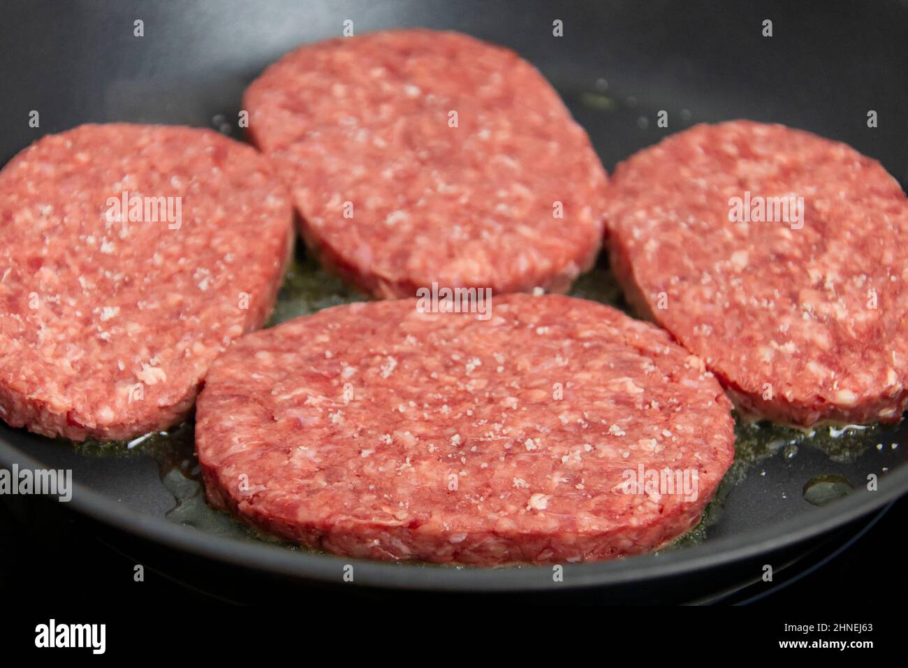 raw ground beef cooking in a skillet Stock Photo Alamy