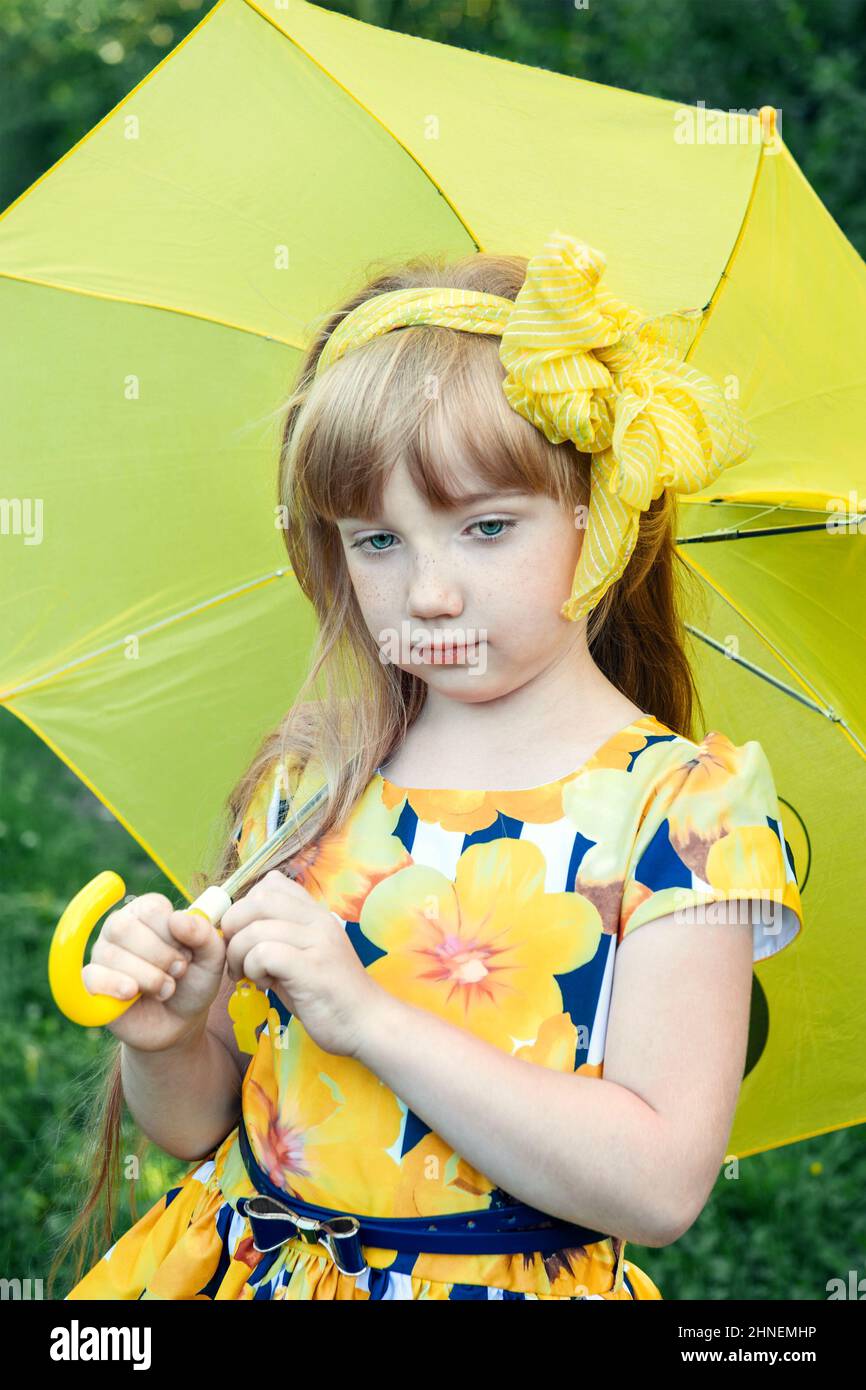 Beautiful Red Haired Girl With A Yellow Bow And A Yellow Umbrella An 11 Year Old Girl Looks Sad 
