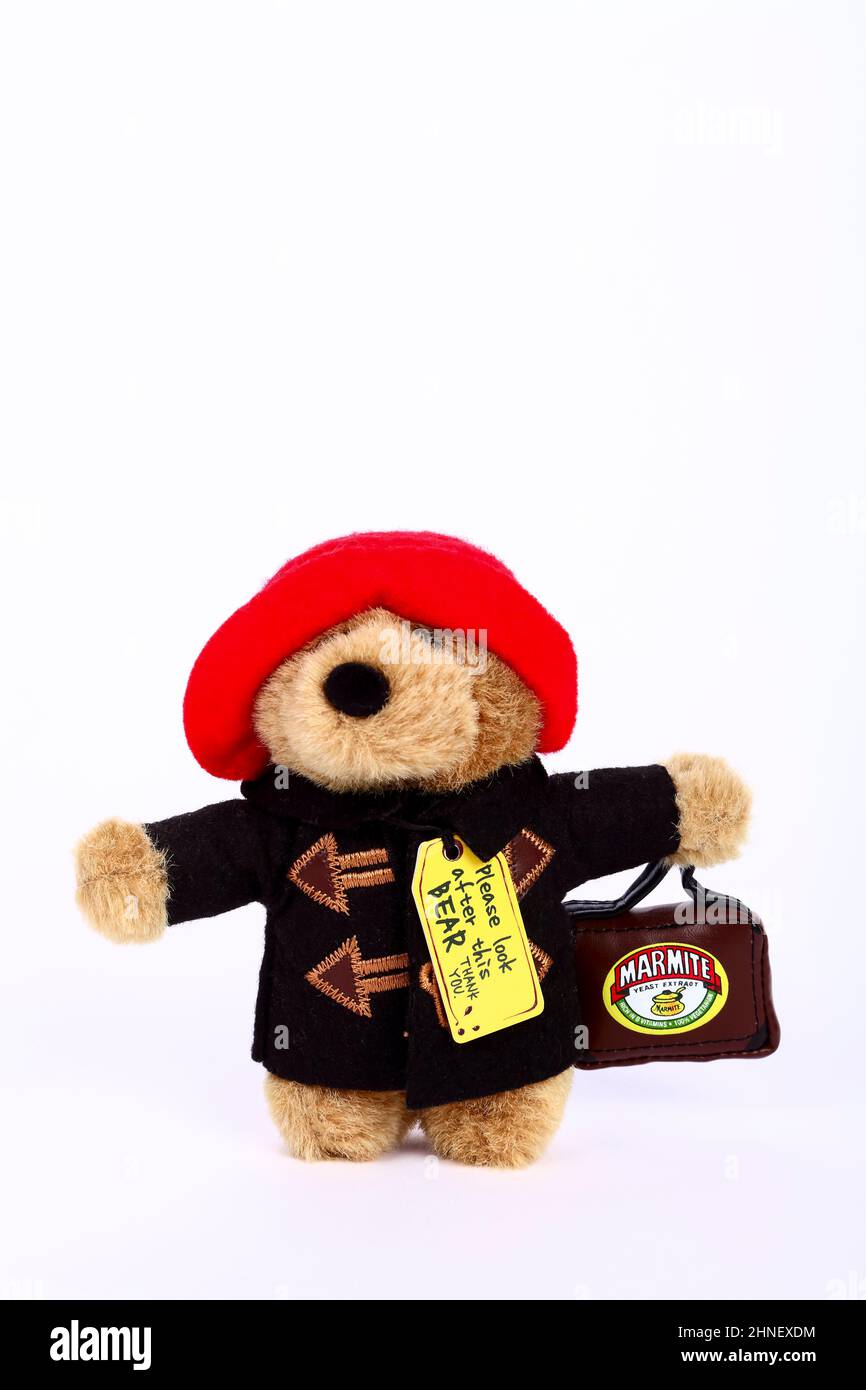 collectable paddington bear holding a marmite suitcase with copy space,Editorial use only Stock Photo