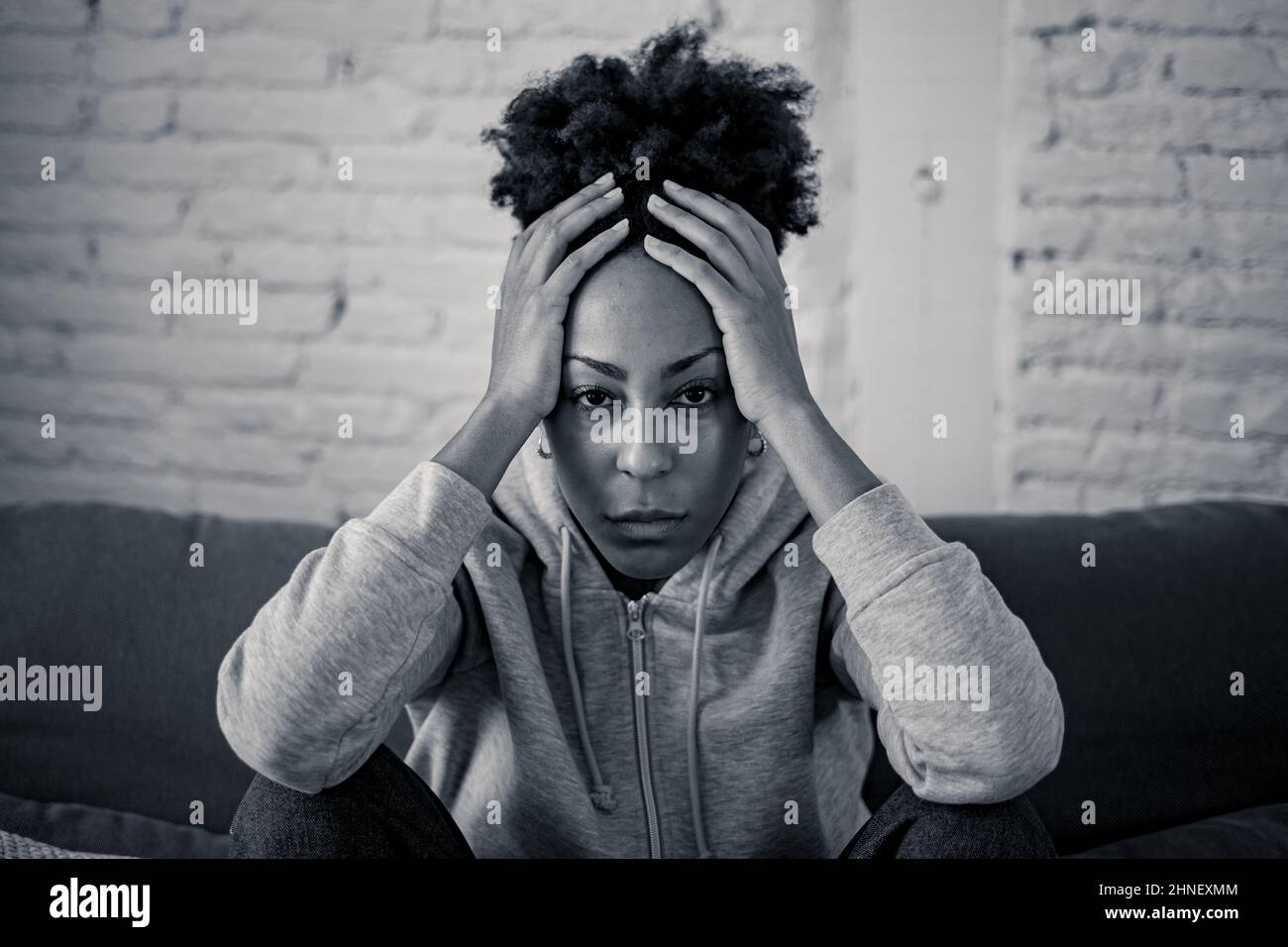 Young devastated depressed african american woman crying feeling sad, hurt suffering depression in sadness and emotional pain. Mental health in young Stock Photo