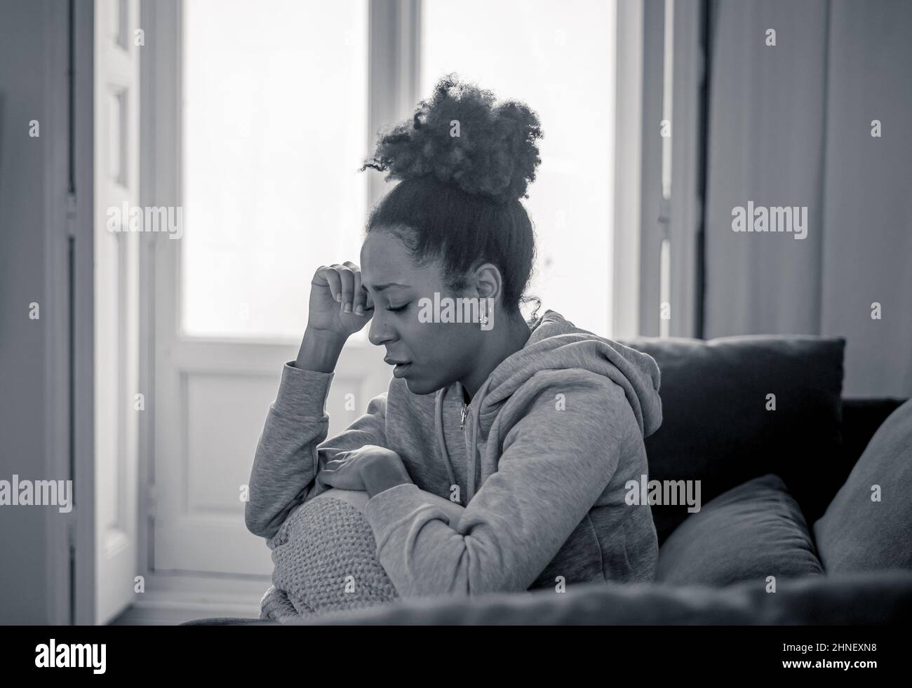 Unhappy lonely young african american woman suffering from anxiety