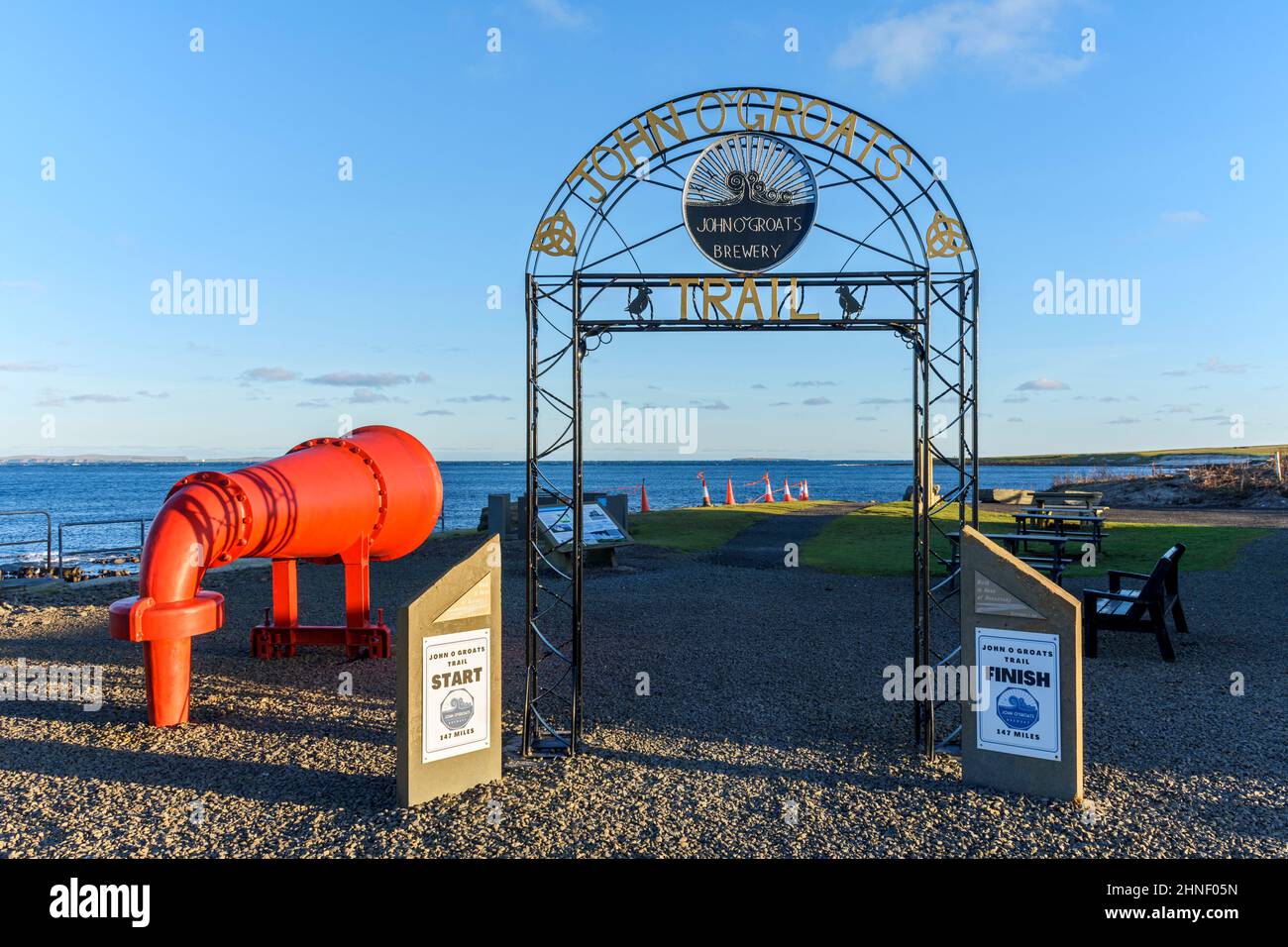 Wrought iron arch and a foghorn at the start (or finish) of the John o'Groats Trail, John o'Groats, Caithness, Scotland, UK Stock Photo