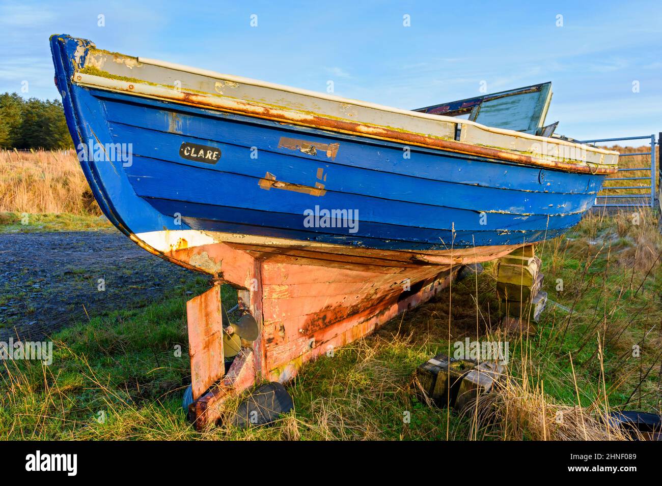 Abandoned boat on a farm track near the village of Mey, Caithness, Scotland, UK Stock Photo