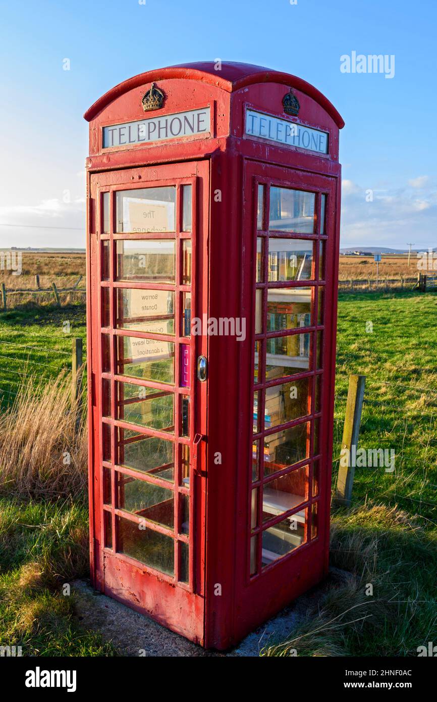 The Exchange, formerly Marks Book Kiosk, in a former BT telephone box.  At Scarfskerry, Caithness, Scotland, UK Stock Photo