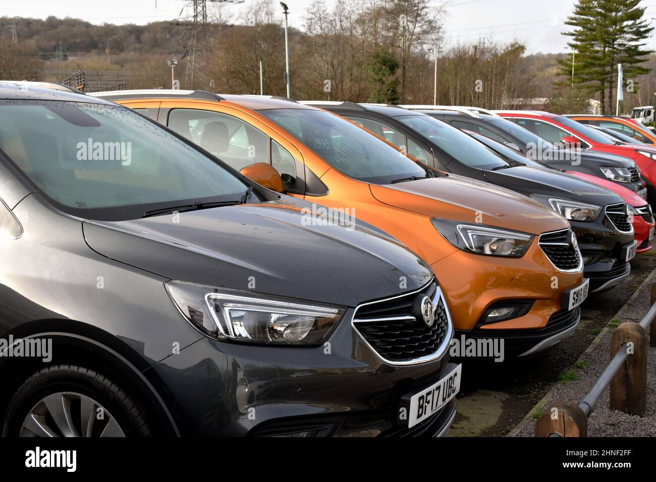 Treforest, Wales - February 2022: Row of second hand cars on sale outside a Vauxhall car dealership Stock Photo