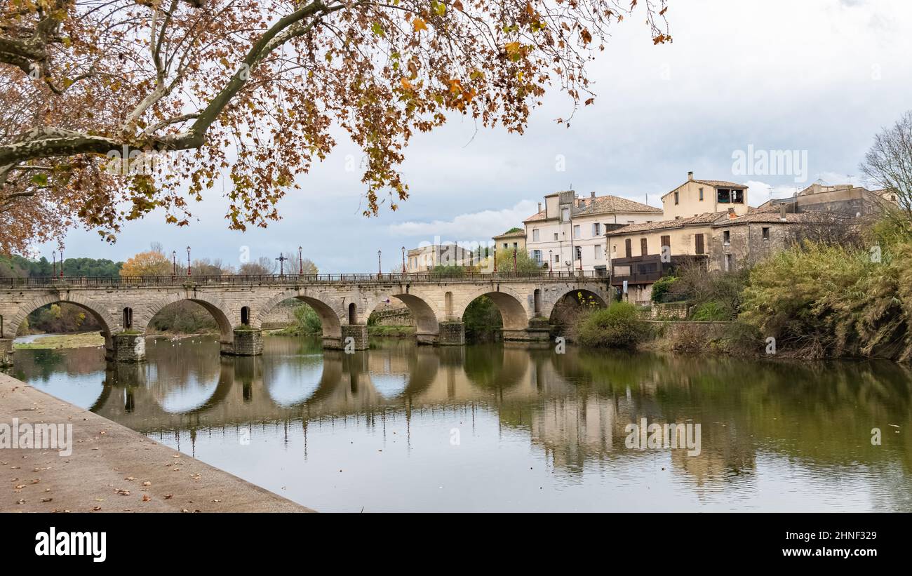 Sommieres, medieval village in France, view of the roman bridge Stock Photo