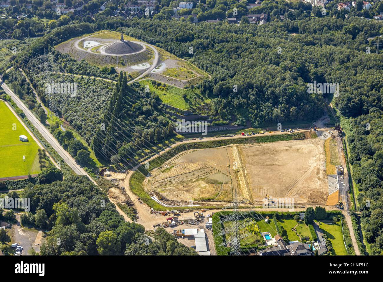 Aerial photograph, Rheinelbe slag heap and construction site rainwater retention basin at the Wattenscheider Bach in Ückendorf, Gelsenkirchen, Ruhr ar Stock Photo