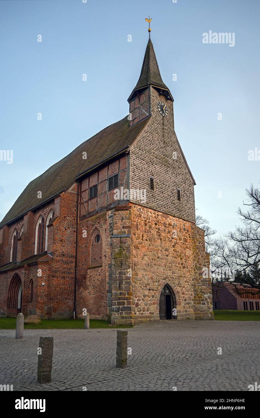 Historic church of Zarrentin am Schaalsee built from fieldstones, red bricks and wooden shingles, northern Germany, copy space, selceted focus Stock Photo