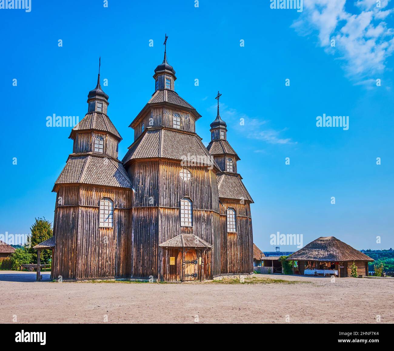 The splendid wooden Intercession Church, located in the middle of the courtyard of Zaporizhian Sich scansen, Zaporizhzhia, Ukraine Stock Photo