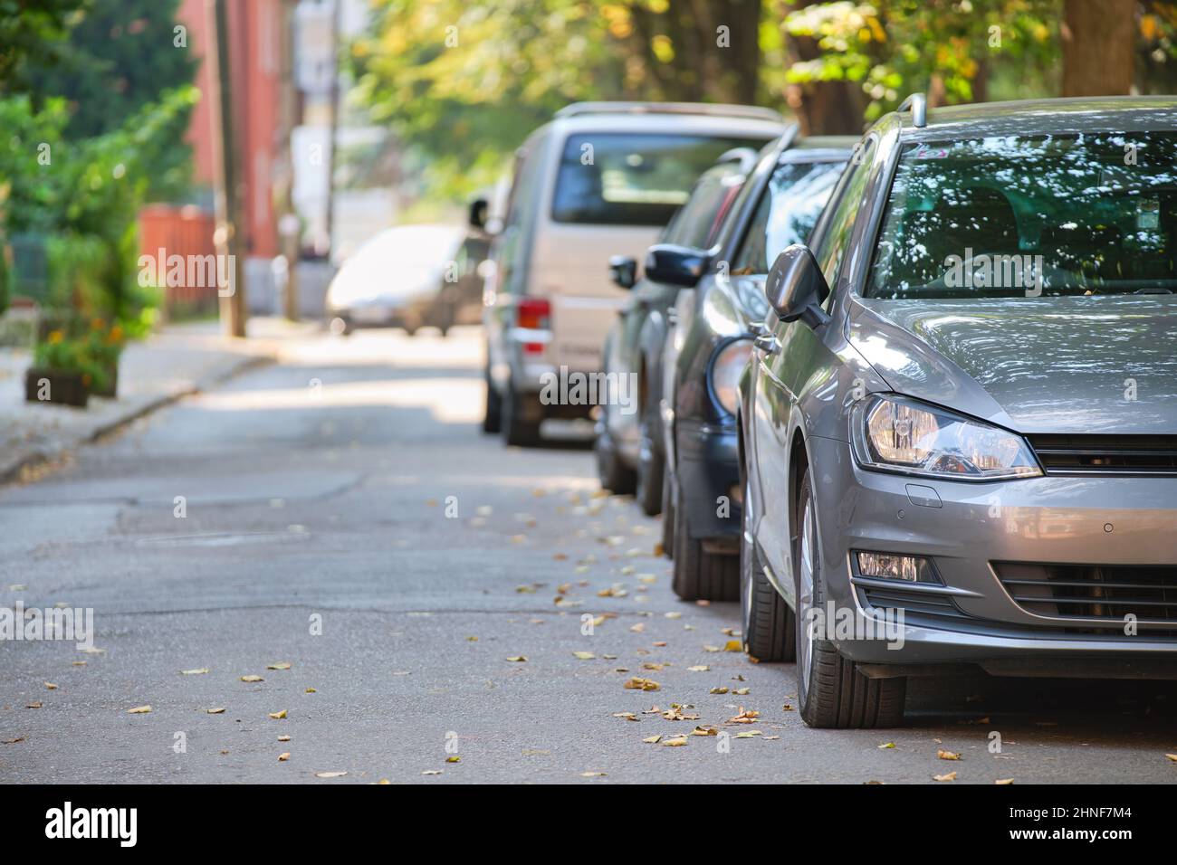City traffic with cars parked in line on street side Stock Photo Alamy