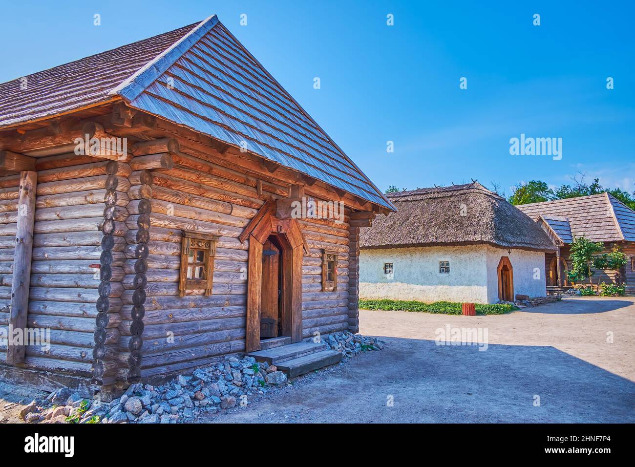 The old wooden and adobe houses in Zaporizhian Sich scansen, Zaporizhzhia, Ukraine Stock Photo