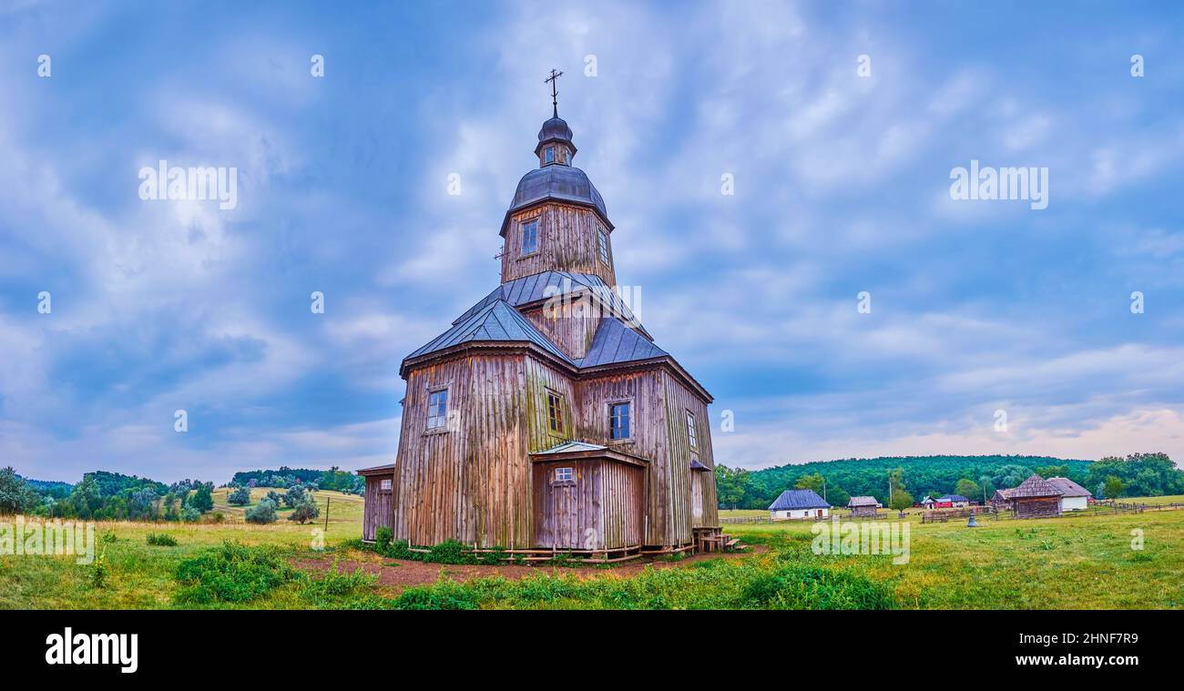 Pamoramic view on wooden historical St Nicholas Church located in Cossack Village Scansen in Stetsivka, Ukraine Stock Photo