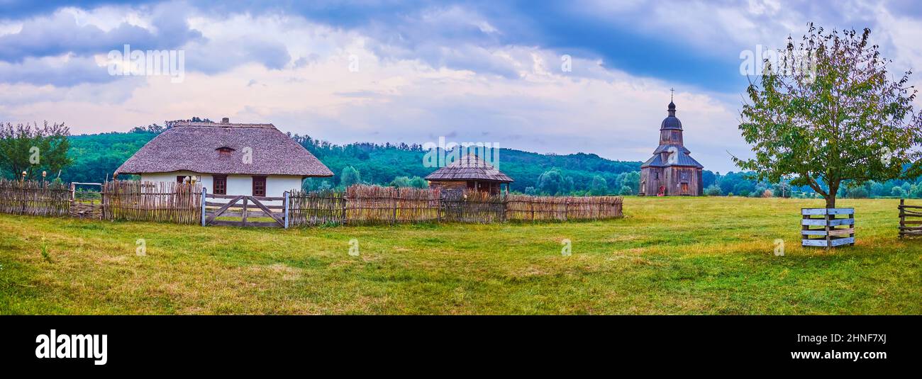 Panorama of  the peasants farmhouses and St Nicholas Church of Cossack Village Scansen, Stetsivka village, Ukraine Stock Photo