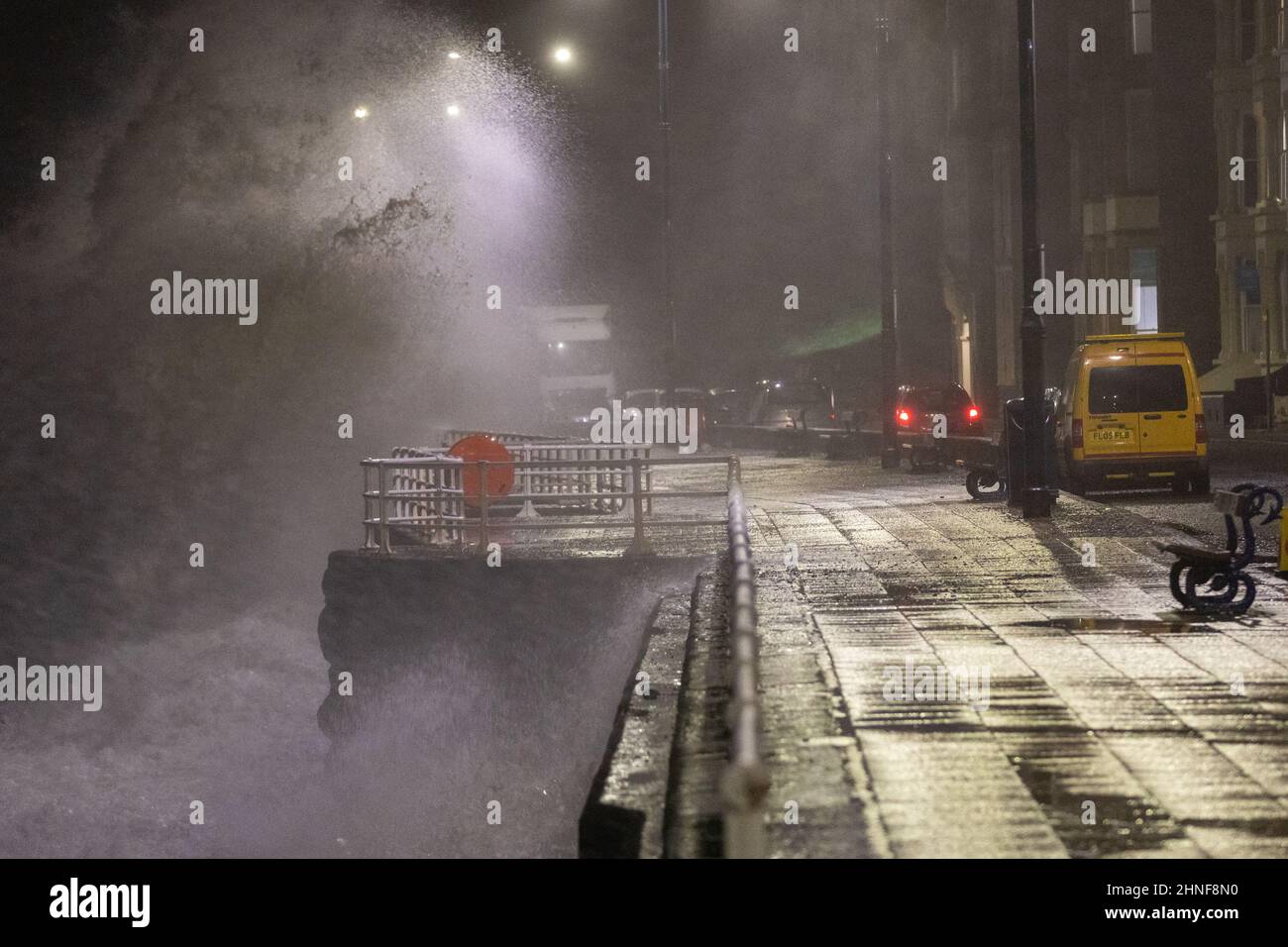 Aberystwyth, Ceredigion, Wales, UK. 16th February 2022  UK Weather: A windy night in Aberystwyth, as storm Dudley combines with a high tide, bringing rough seas crashing against the promenade. © Ian Jones/Alamy Live News Stock Photo