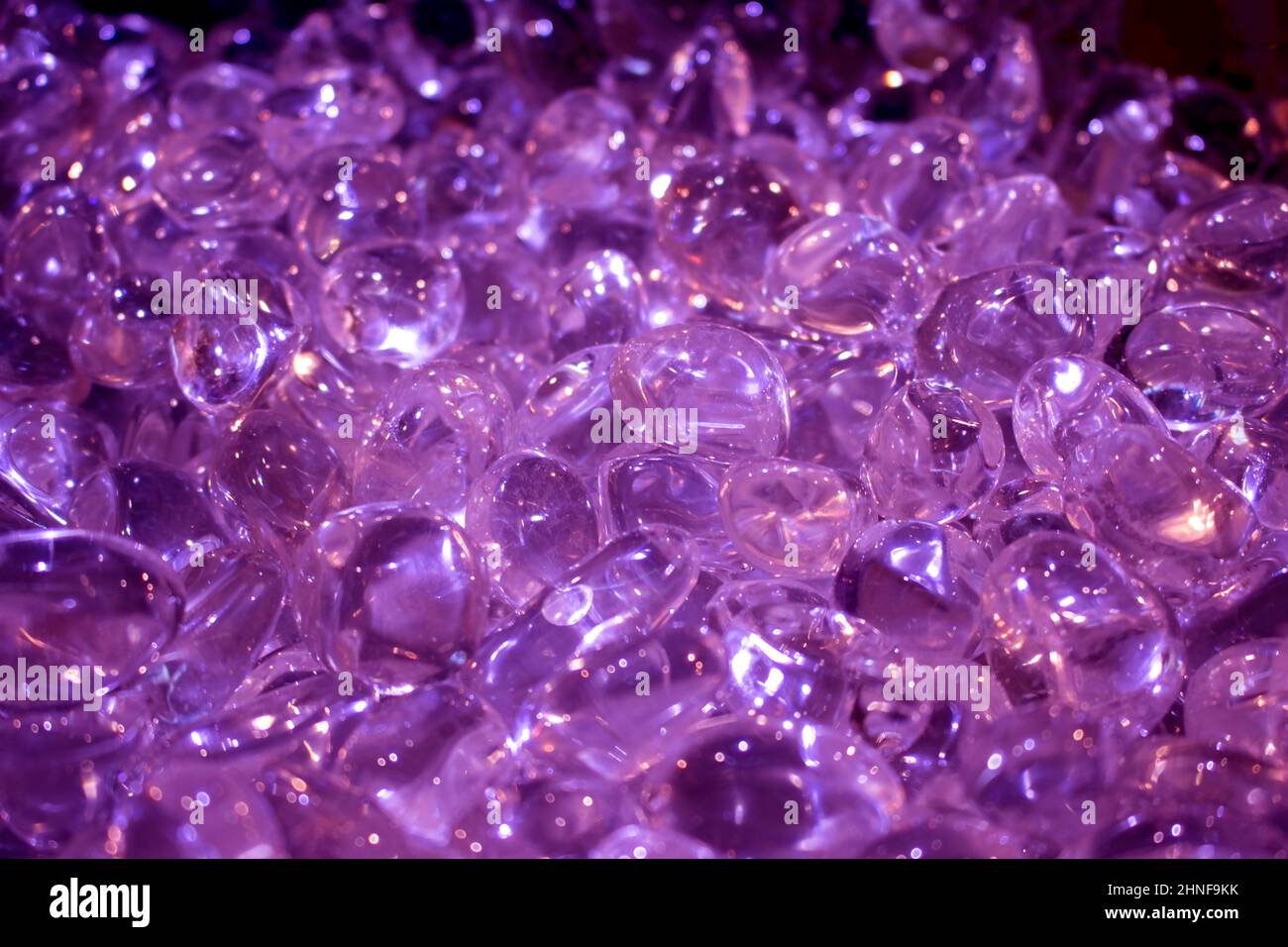 Quartz stone crystals on polished slab Full frame of colorful gemstones