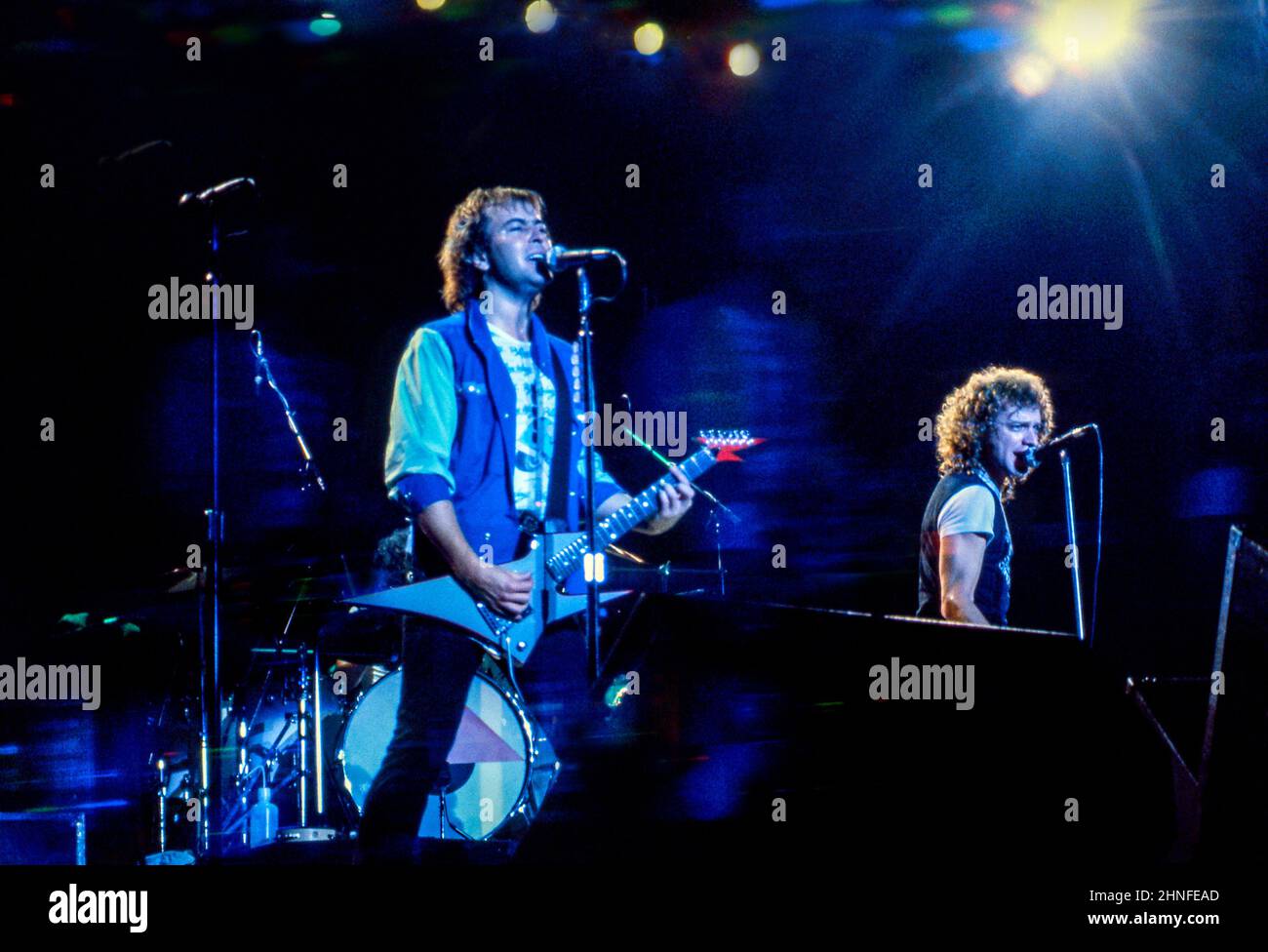 Guitarist Mick Jones and singer Lou Gramm performing with of Anglo-American band Foreigner at Wembley Arena, London in 1982. Stock Photo