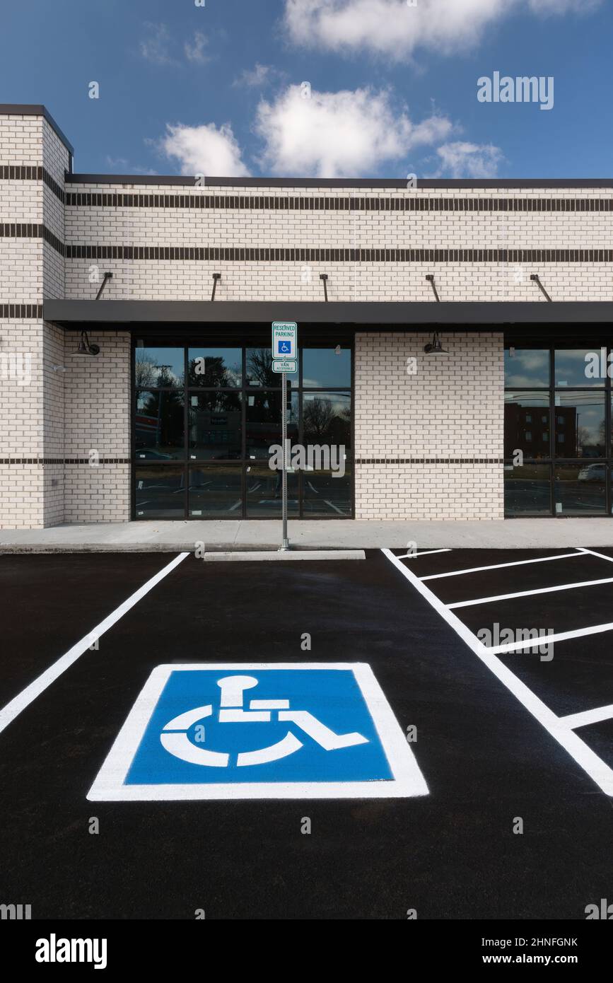 Vertical shot of a handicapped parking space at a new retail shopping center that is under construction. Stock Photo