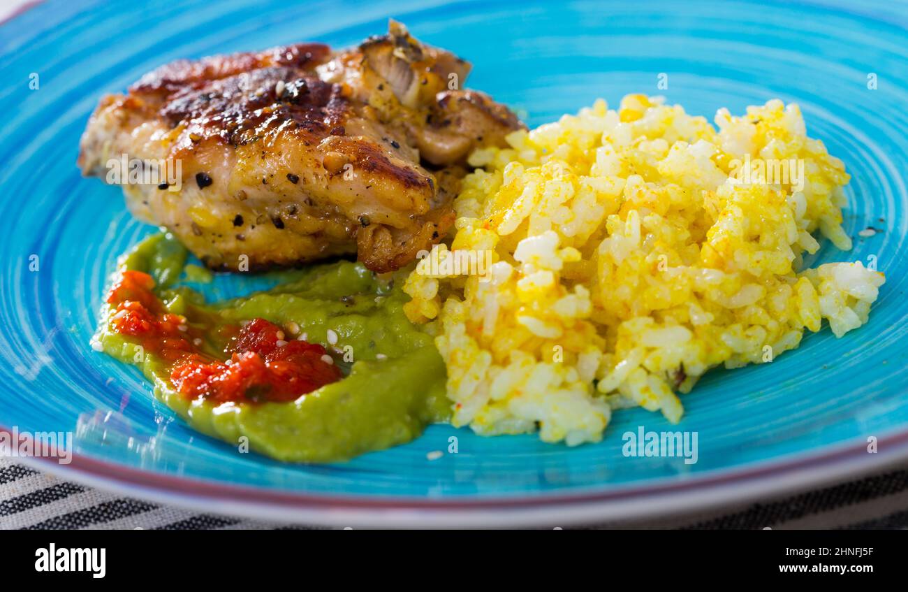 Fried chicken thighs with rice Stock Photo Alamy
