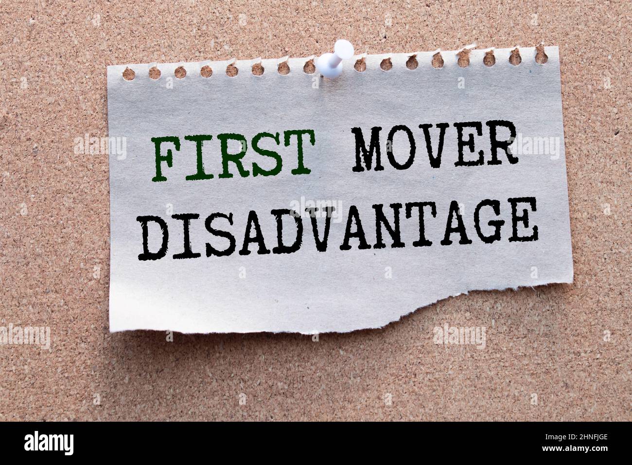 text First Mover Disadvantage on torn paper Stock Photo