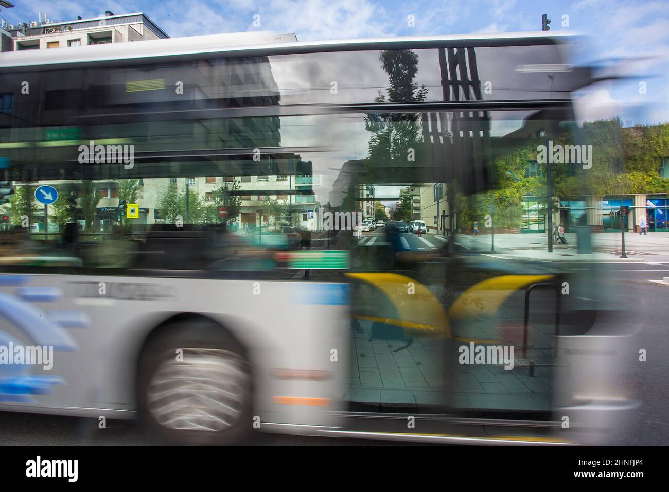 Mobility in the city of Vitoria, bus, cars  and people moving around the city at the same time. Stock Photo