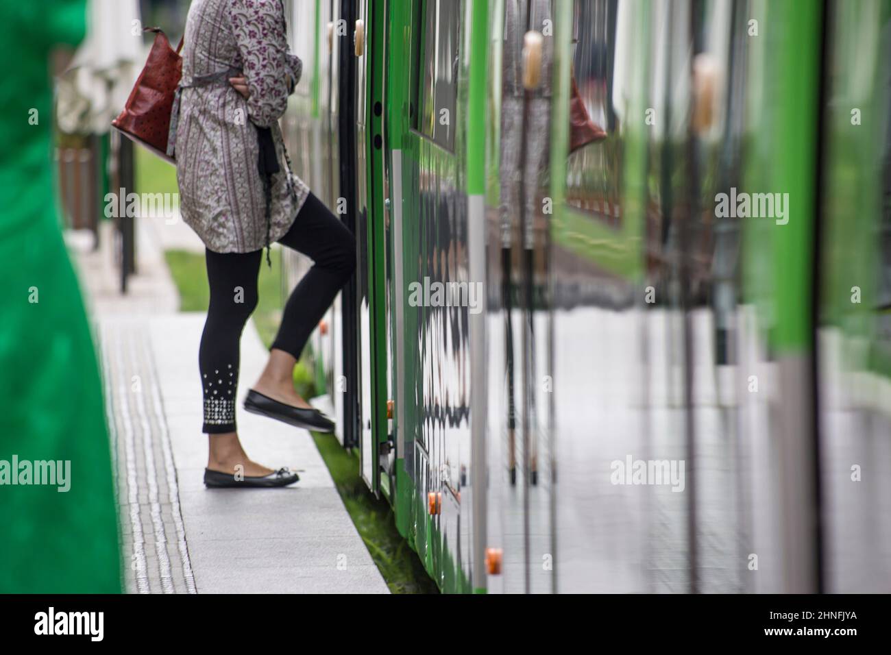 Mobility in the city of Vitoria, tram and people moving around the city at the same time. Stock Photo