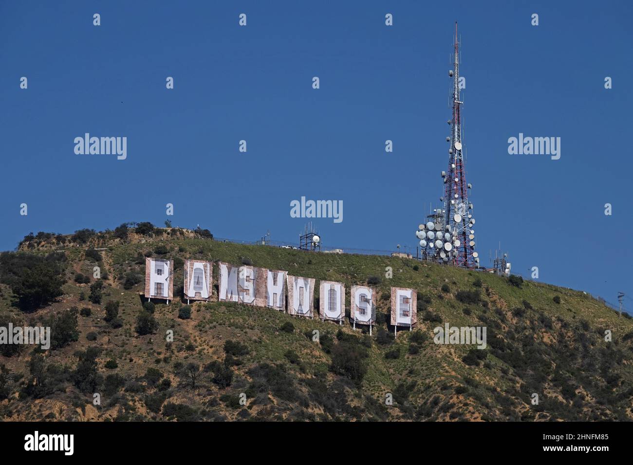 Hollywood, CA / USA - Feb. 16, 2022: Banners spelling out RAMS HOUSE are shown coverin the letters of the iconic Hollywood sign. Stock Photo