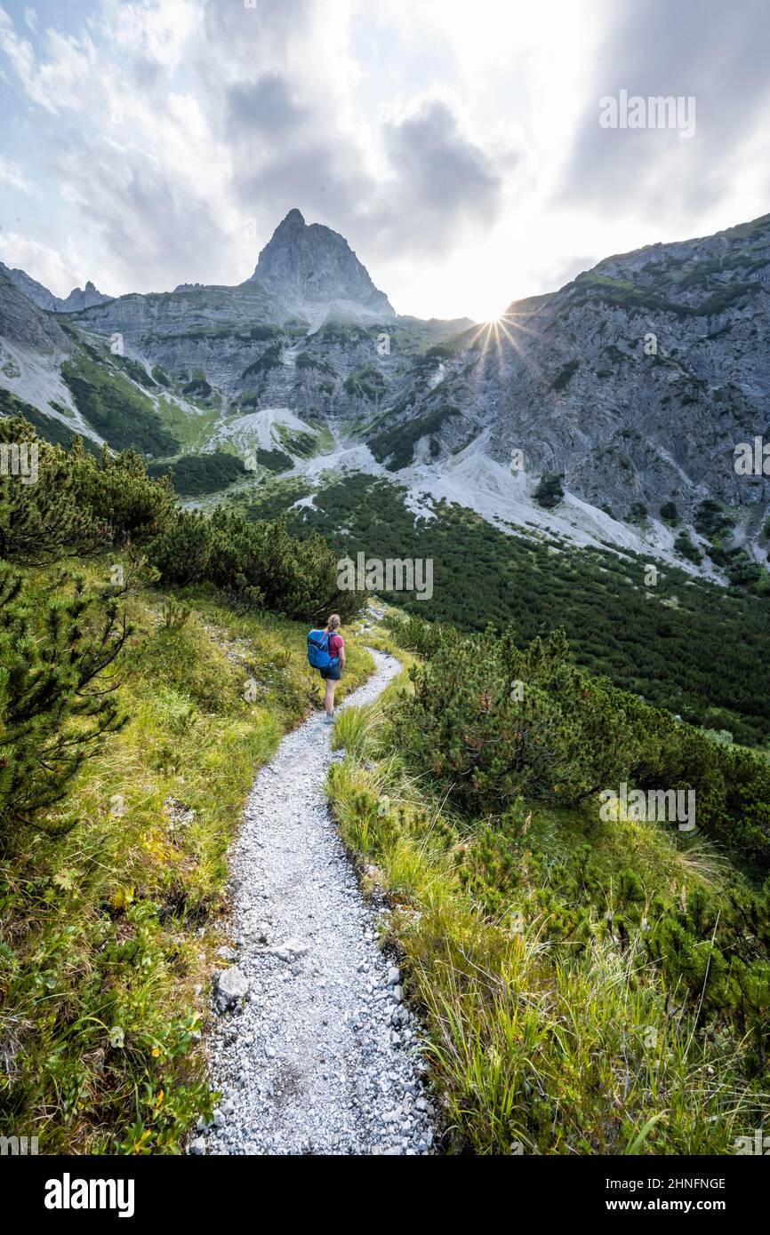 Sun star, hiker on the way to Lamsenspitze, Tyrol, Austria Stock Photo ...