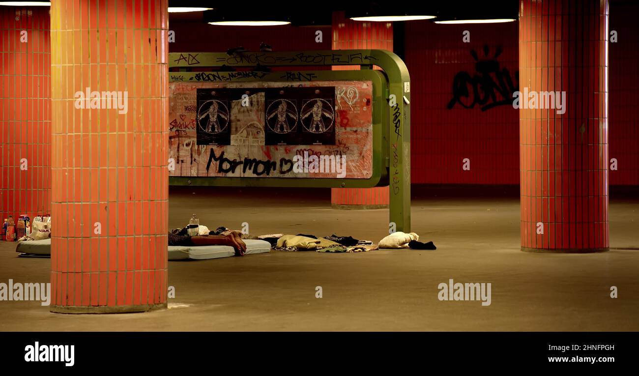 Sleeping homeless man in the pedestrian subway at the Congress Centre ICC in Charlottenburg, Berlin, Germany Stock Photo