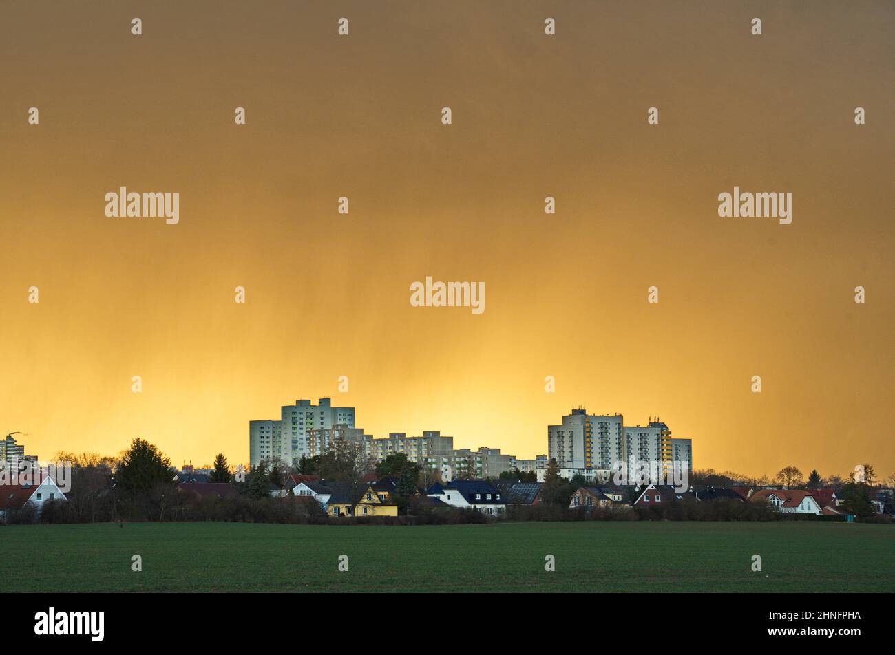 Yellow sky in front of a thunderstorm over Gropiusstadt, Neukoelln district, Berlin, Germany Stock Photo