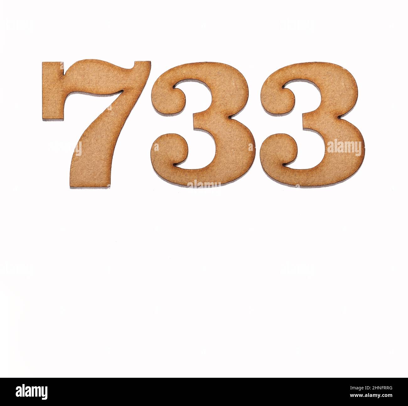 Number 733 in wood, isolated on white background Stock Photo - Alamy