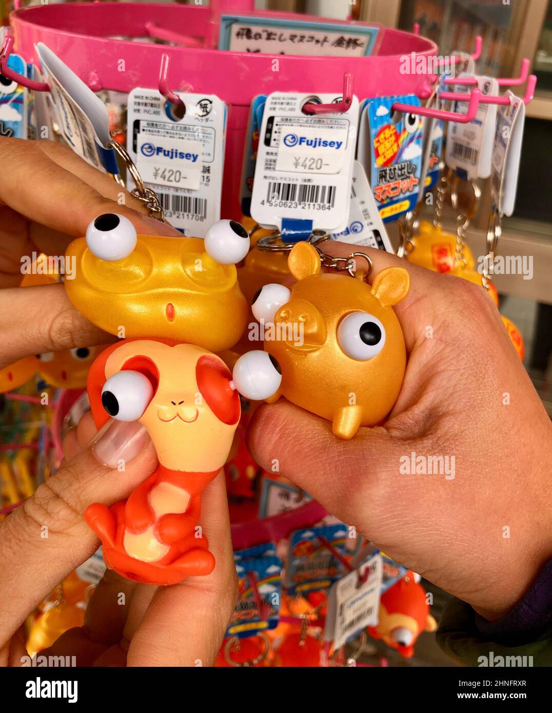 Funny key rings, animal figures with protruding eyes, souvenirs in a shop, Japan Stock Photo